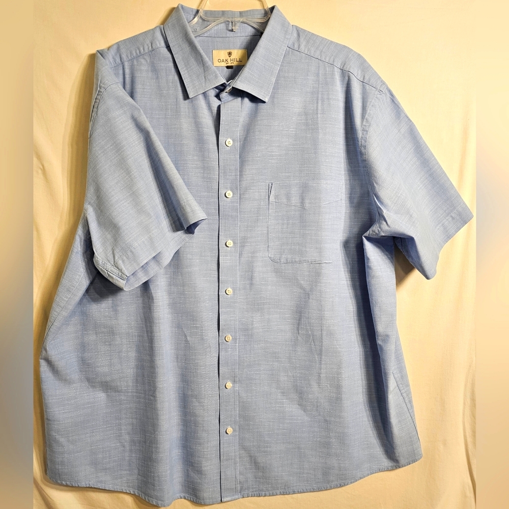 Pre-owned short sleeve blue shirt excelente condition.